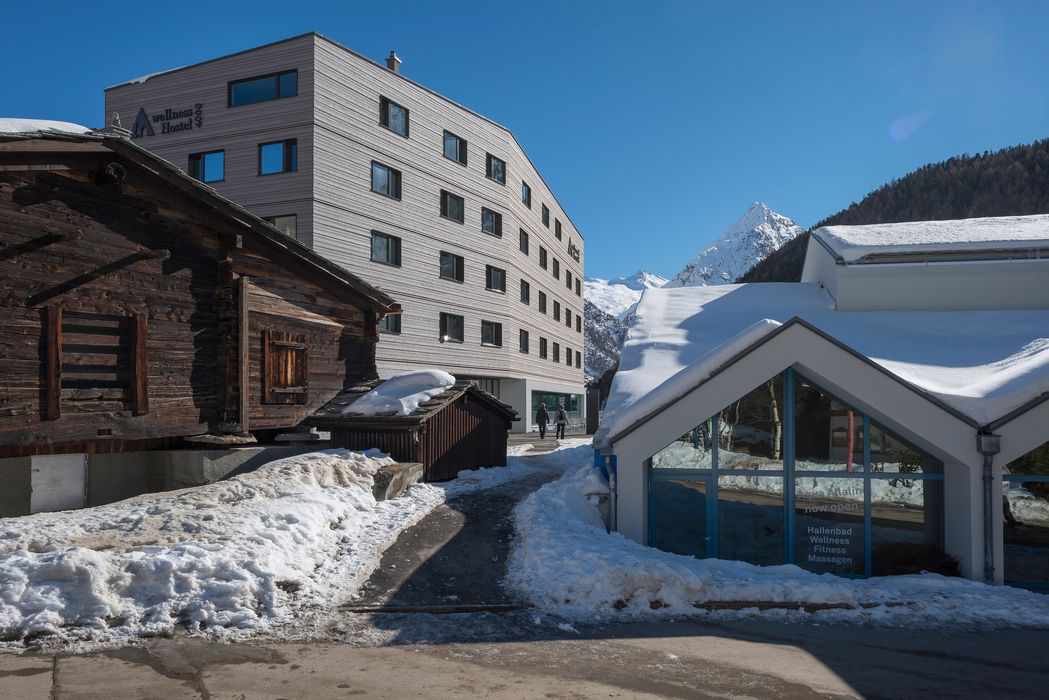 Outside view winter Saas-Fee Youth Hostel from near